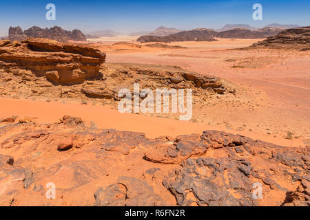 Reddish Sand And Rock Landscapes In The Desert Of Wadi Rum, Southern Jordan Stock Photo