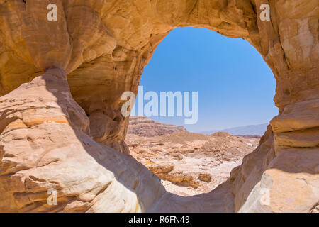 The Big Natural Rock Arch Formation And Desert View In Timna National Park, Israel Stock Photo