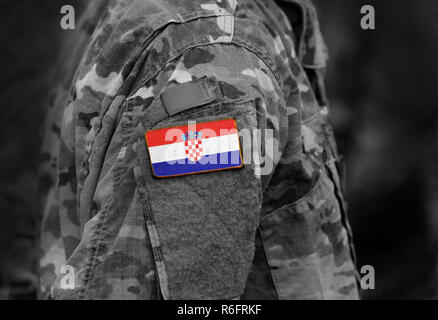 Flag of Croatia on soldiers arm (collage). Stock Photo