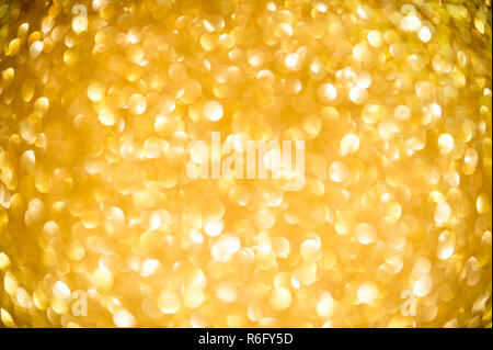 Festive holiday background of bright golden bokeh bubbles of light in a full frame abstract Stock Photo
