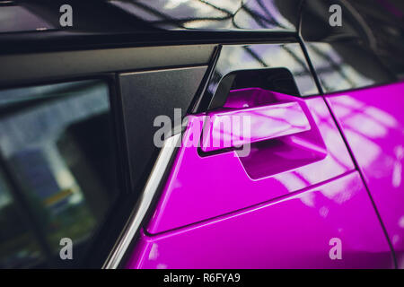 abstract photo car door handle pink and lock Stock Photo