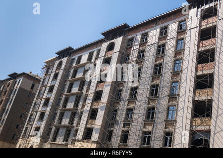 marble finishing works on the facade of a high building Stock Photo