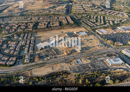 Aerial late afternoon view of homes, shopping center construction and Rinaldi Street in the fast growing Porter Ranch neighborhood of Los Angeles, Cal Stock Photo