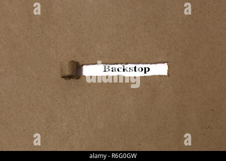 Ripped brown manilla envelope revealing the word backstop on white paper.  UK Brexit deal concept Stock Photo