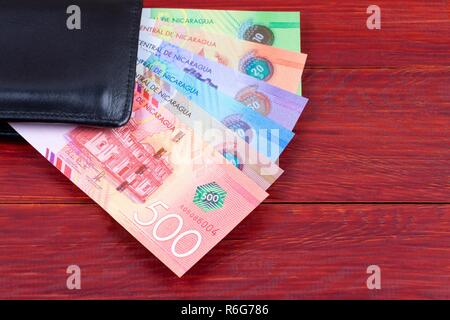 Nicaraguan money in the black wallet Stock Photo