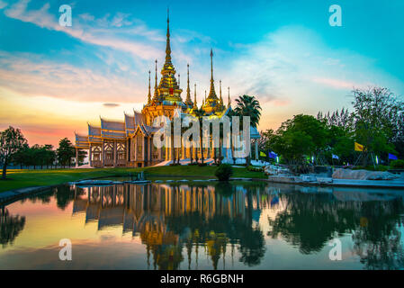 temple thailand / beautiful thailand temple dramatic colorful sky twilight sunset shadow on water reflection - Landmark Nakhon Ratchasima province tem Stock Photo