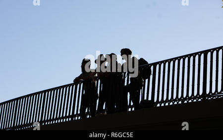 Group of young hipster on a bridge in daylight Stock Photo