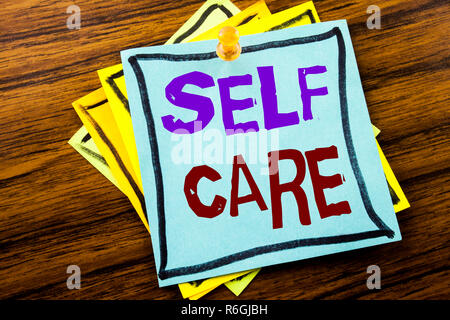 Writing text showing Self Care. Business concept for Taking caring for own Health written on sticky note paper on the wooden background. Stock Photo