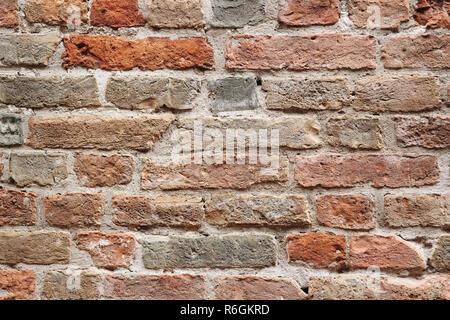Real old red brick wall of ancient building texture background Stock Photo