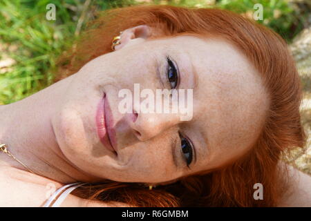 portrait of a young red-haired woman Stock Photo