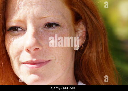 portrait of a young red-haired woman Stock Photo