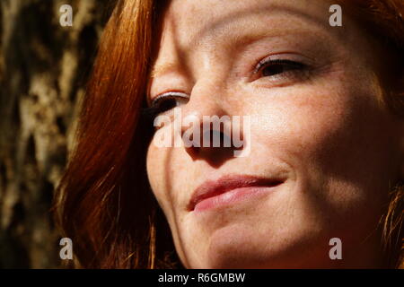 portrait of a young red-haired woman Stock Photo