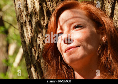 portrait of a young red-haired woman Stock Photo