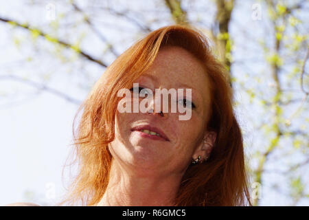 portrait of a young red-haired woman Stock Photo