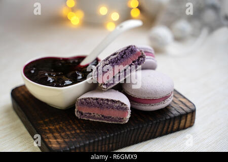 macaroons with currants on a white plate with jam Stock Photo