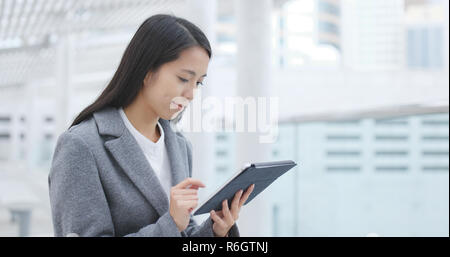 Businesswoman work on tablet Stock Photo