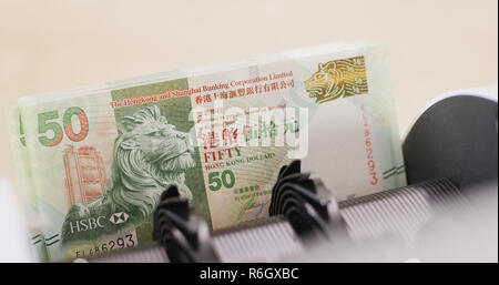 Hong Kong dollar on counting machine Stock Photo