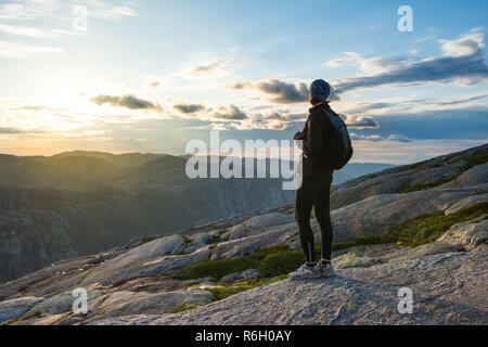 Woman successful hiking silhouette in mountains, motivation and inspiration in sunset Stock Photo