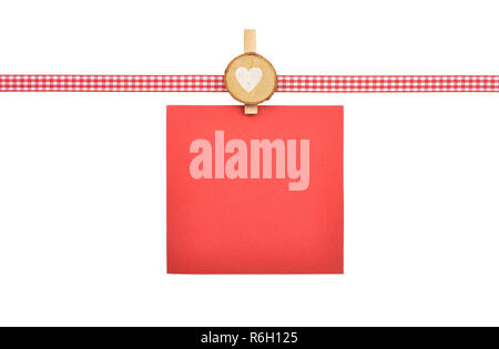 Red-white checked ribbon with paper on white Stock Photo