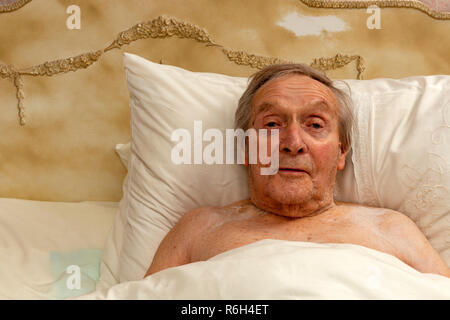 92-year old man in bed Stock Photo