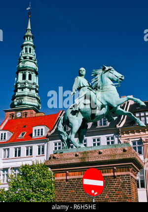 Bronze equestrian statue of Absalon the founder of Copenhagen and St Nicholas church spire, Hojbro Plads, Copenhagen, Denmark, Scandinavia Stock Photo