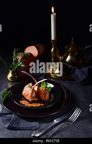 lamb steaks with rosemary sweet potatoes Stock Photo