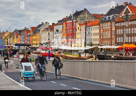 Tricycle and bicycles on cycle path, Nyhavn (New Harbour), Copenhagen, Denmark, Scandinavia Stock Photo