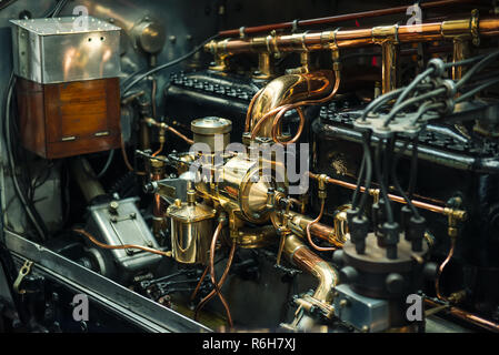 Close up view of posh and expensive vintage classic retro car detailed engine parts. Selective focus Stock Photo