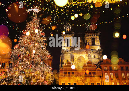 Decorated Christmas tree stands on the main square in Prague during the New Year holidays. Stock Photo