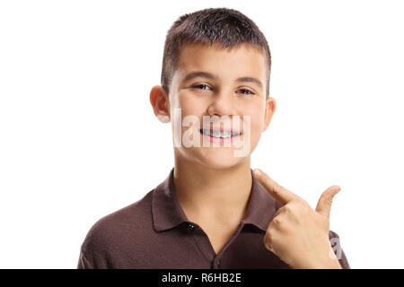 Boy with dental braces pointing on the mouth isolated on white background Stock Photo