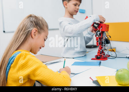 children working on task at STEM robotics lesson Stock Photo
