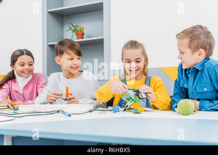 schoolchildren working on robot programming at STEM class Stock Photo