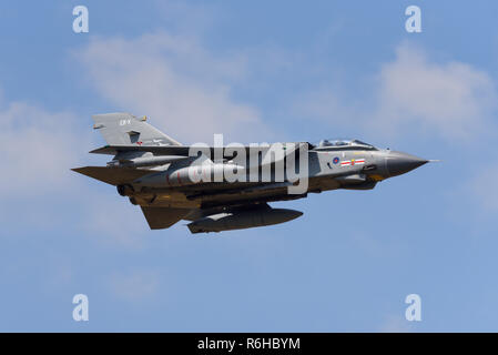 Royal Air Force, RAF Panavia Tornado GR4 jet fighter bomber plane flying at Royal International Air Tattoo, RIAT, RAF Fairford air show. Fast. Speed Stock Photo