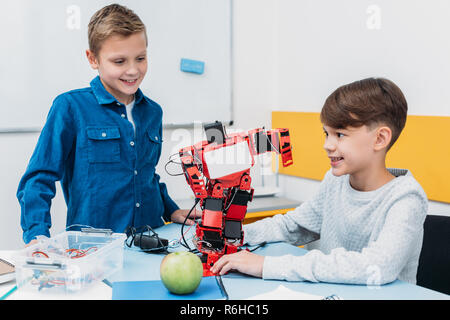 schoolboys working on robot at STEM robotics lesson Stock Photo