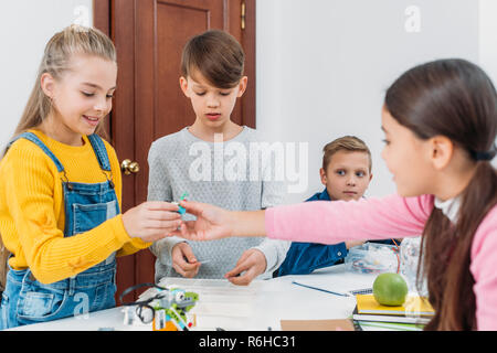 schoolchildren working on robot programming at STEM class Stock Photo
