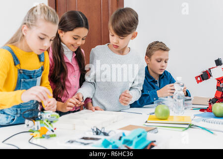 focused children working together on STEM project in classrom Stock Photo