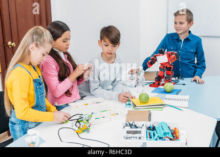 focused children working together on STEM project in classrom Stock Photo