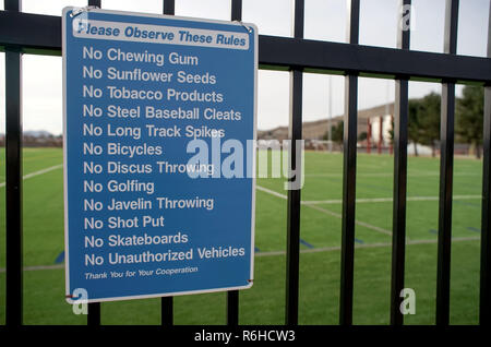 A do not do list posted on the entrance of a football practice field, in Alpine Texas. Stock Photo