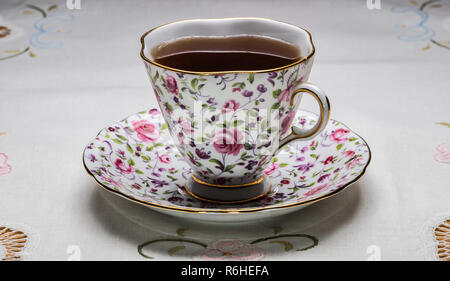 royal vale bone china tea cup with tea, and saucer Stock Photo