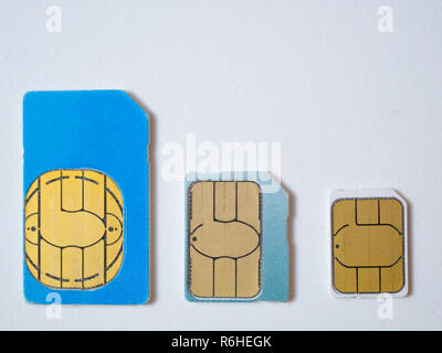 three sim cards micro, nano 4g lte 5g ready on white background. flat lay shot from the top Stock Photo