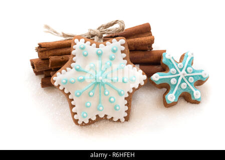 Christmas dekoration with cookies in the shape of snowflakes and stars on a white background Stock Photo