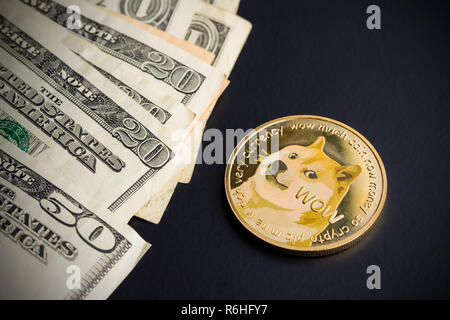 Dogecoin and dollars. Stock Photo