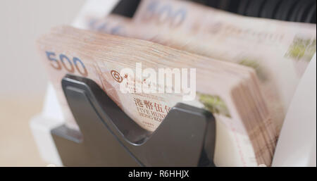 Electronic money counter machine, counting Hong Kong dollar Stock Photo