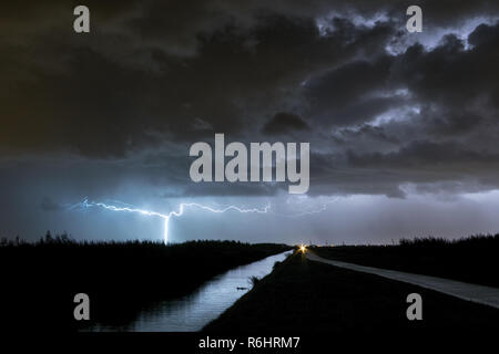 Bright lightning strike from an autumn thunderstorm in the Green Heart of  Holland, close to Gouda and Rotterdam. Special positive lightning strike  Stock Photo - Alamy
