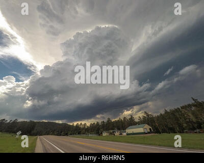 Severe rotating thunderstorm over the Black Hills in South Dakota. This supercell storm dropped very large hail, up to three inches in diameter. Stock Photo