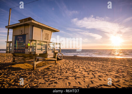 Lifeguard tower on one of the sandy Malibu beaches; beautiful sunset light; Pacific Ocean coastline, California Stock Photo