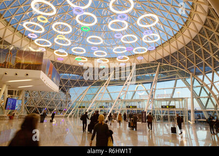 Marrakech airport - passengers in the interior of the modern arrivals terminal opened in 2016; Marrakesh Morocco North Africa Stock Photo