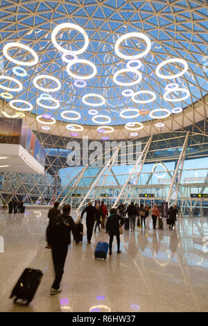 Marrakech airport - passengers in the interior of the modern arrivals terminal opened in 2016; Marrakesh Morocco North Africa Stock Photo