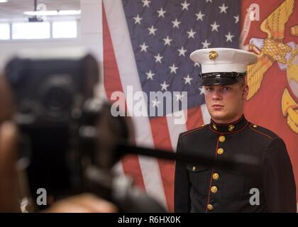 Rct. Richard E. Fox III, Platoon 3044, Lima Company, 3rd Recruit Training Battalion, poses for his first official photo April 27, 2017, on Parris Island, S.C. This photo is normally identified as a Marine’s official Marine Corps photo and has been taken in training since the 1950’s. Fox, 22, from Lignum, Va., is scheduled to graduate June 16, 2017. Parris Island has been the site of Marine Corps recruit training since Nov. 1, 1915. Today, approximately 19,000 recruits come to Parris Island annually for the chance to become United States Marines by enduring 12 weeks of rigorous, transformative  Stock Photo