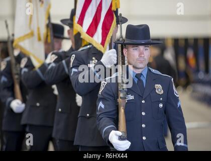 The Anne Arundel County Police present their colors during the 31st Annual Massing of the Colors, Fort George G. Meade, Md., May 21, 2017. Massing of the Colors is a patriotic ceremony that combines colors and color guards of Active, Reserve, and National Guard military components as well veteran, civic, and patriotic organizations. Stock Photo